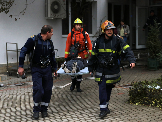 Volunteers from the organization with a man on a stretcher
